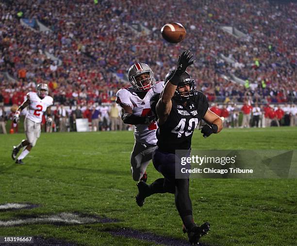 Northwestern fullback Dan Vitale is unable to catch a ball in the end zone as Ohio State safety C.J. Barnett defends in the first quarter at Ryan...