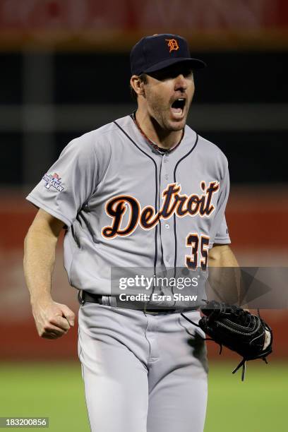 Justin Verlander of the Detroit Tigers reacts after striking out Stephen Vogt of the Oakland Athletics to end the seventh inning during Game Two of...