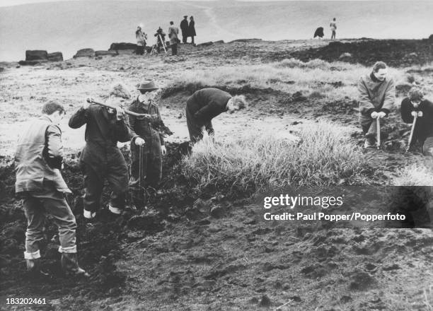 Searchers digging in peat on Saddleworth Moor, near Greenfield, Yorkshire, in the search for victims of the Moors murderers, Ian Brady and Myra...