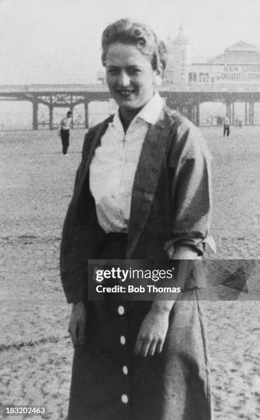 Moors murderer Myra Hindley on the beach at Blackpool, Lancashire, with the Central Pier in the background, circa 1960.