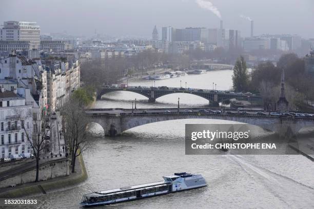 This photograph taken on December 8 shows the Pont de la Tournelle and the Pont de Sully over the Seine, seen from the spire of Notre Dame de Paris...