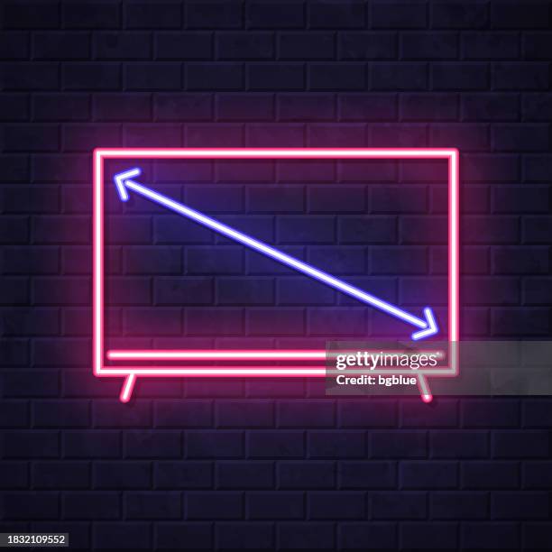 tv screen size. glowing neon icon on brick wall background - inch stock illustrations