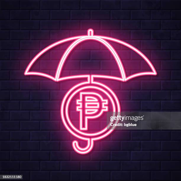 peso coin under umbrella. glowing neon icon on brick wall background - security wall stock illustrations