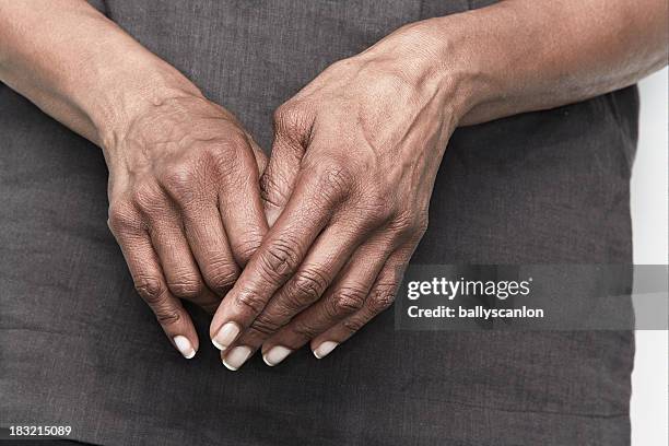 elderly woman with arthritic hands - deformed hand stock pictures, royalty-free photos & images