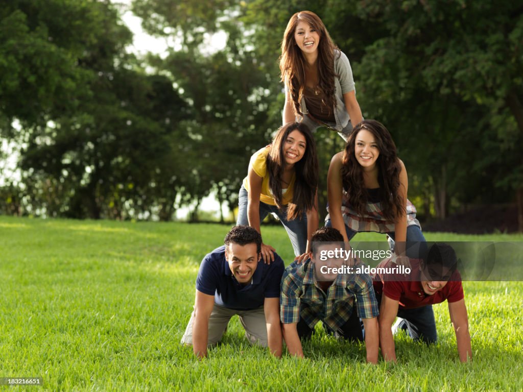 Friends Making A Human Pyramid High-Res Stock Photo - Getty Images