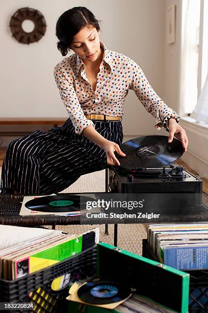 young woman playing records - 2013newwomen stock pictures, royalty-free photos & images