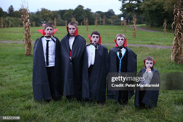 Young vampires pose for a photograph before the Shocktober Fest at Tulleys Farm on October 5, 2013 near Crawley, West Sussex. Each October thousands...