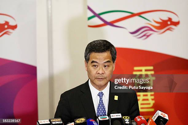 Hong Kong Chief Executive Leung Chun-ying speaksto Hong Kong journalists at a press conference during the APEC Summit on October 6, 2013 in Nusa Dua,...