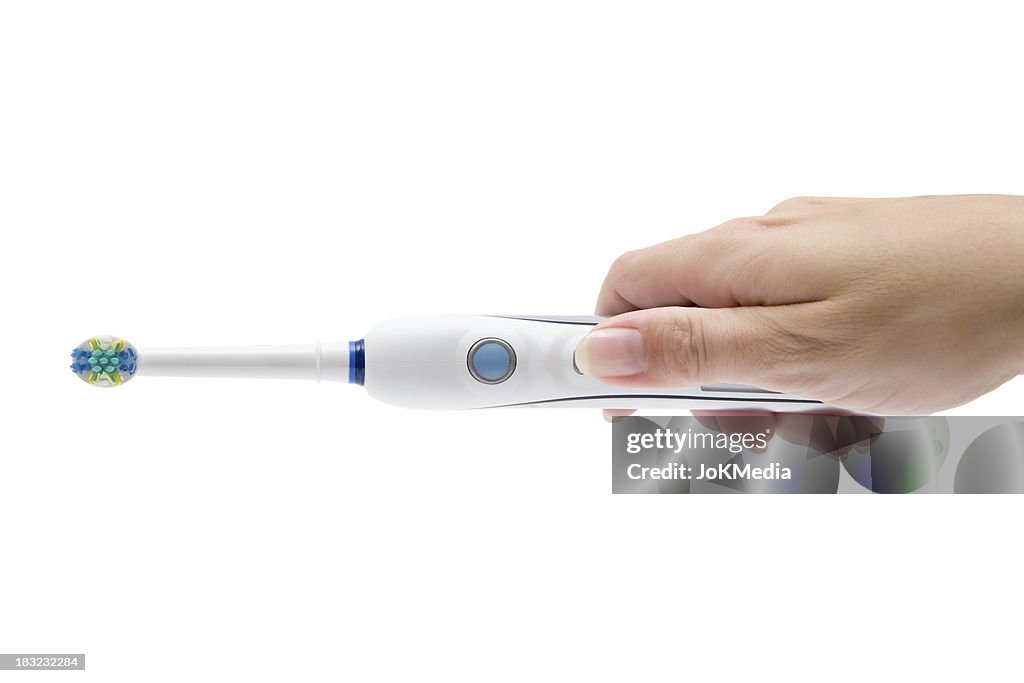 Electric Toothbrush In Her Hand