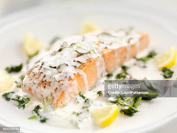 grilled salmon with spinach - savoury sauce stock pictures, royalty-free photos & images