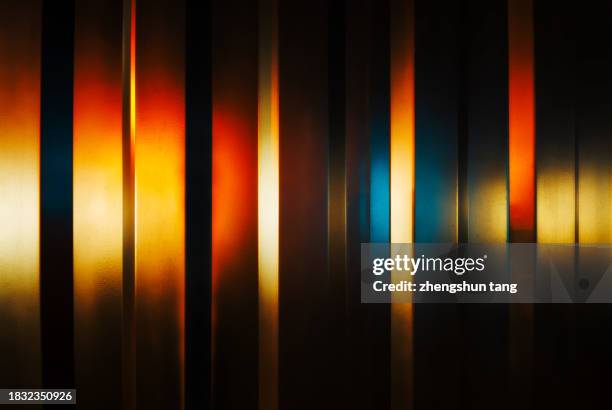 glowing stripes of metal wall in dark - grille en métal photos et images de collection