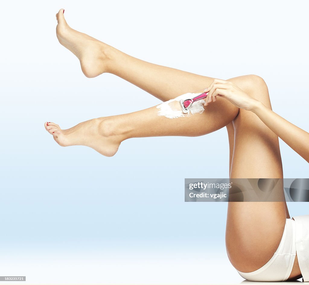 Woman Shaving Legs