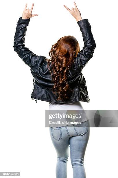 rear view of young woman with arms up gesturing - rock object stockfoto's en -beelden