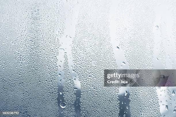 close-up of water drops on a window - blue condensation stock pictures, royalty-free photos & images