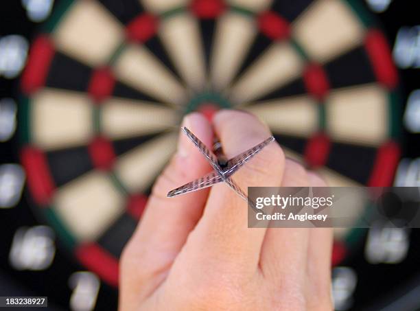 bullseye - darts stock pictures, royalty-free photos & images