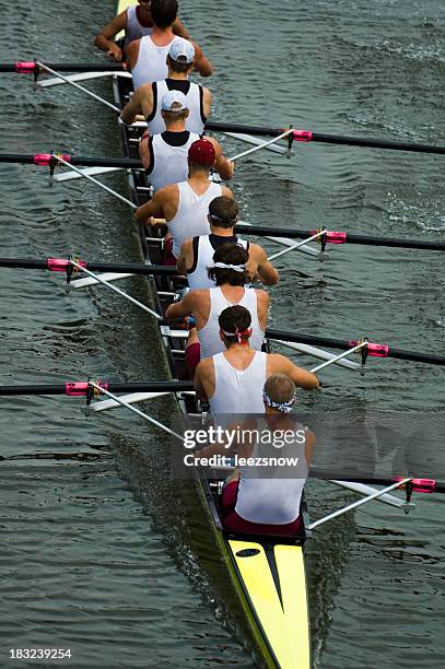 male rowing team on ongoing competition - rowing competition stock pictures, royalty-free photos & images