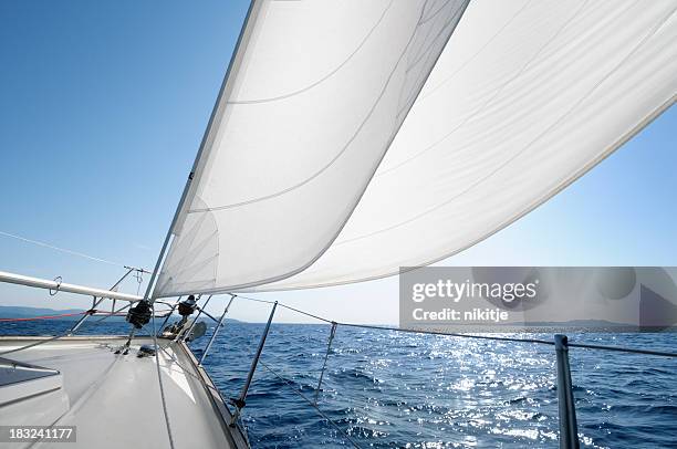 sailing towards the horizon on a sunny day - nautical vessel part stock pictures, royalty-free photos & images