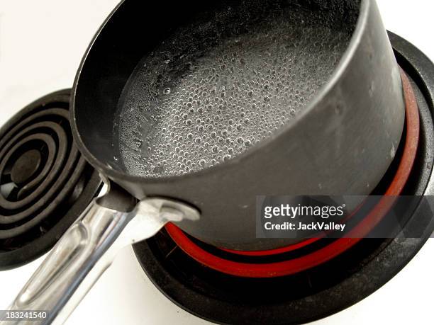 almost-boiling - electric stove burner stock pictures, royalty-free photos & images