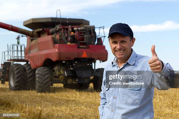 combine and farmer - red combine stock pictures, royalty-free photos & images
