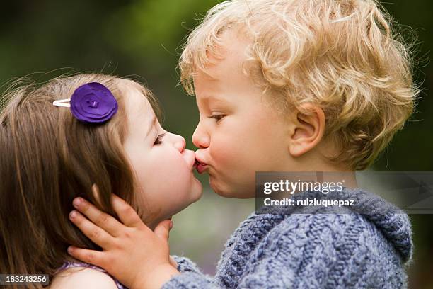 my first kiss - boy girl kissing stock pictures, royalty-free photos & images