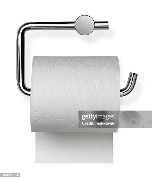 toilet paper sitting on its holder - toilet paper stock pictures, royalty-free photos & images