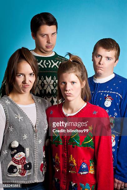 unhappy sweater group - ugliness stock pictures, royalty-free photos & images