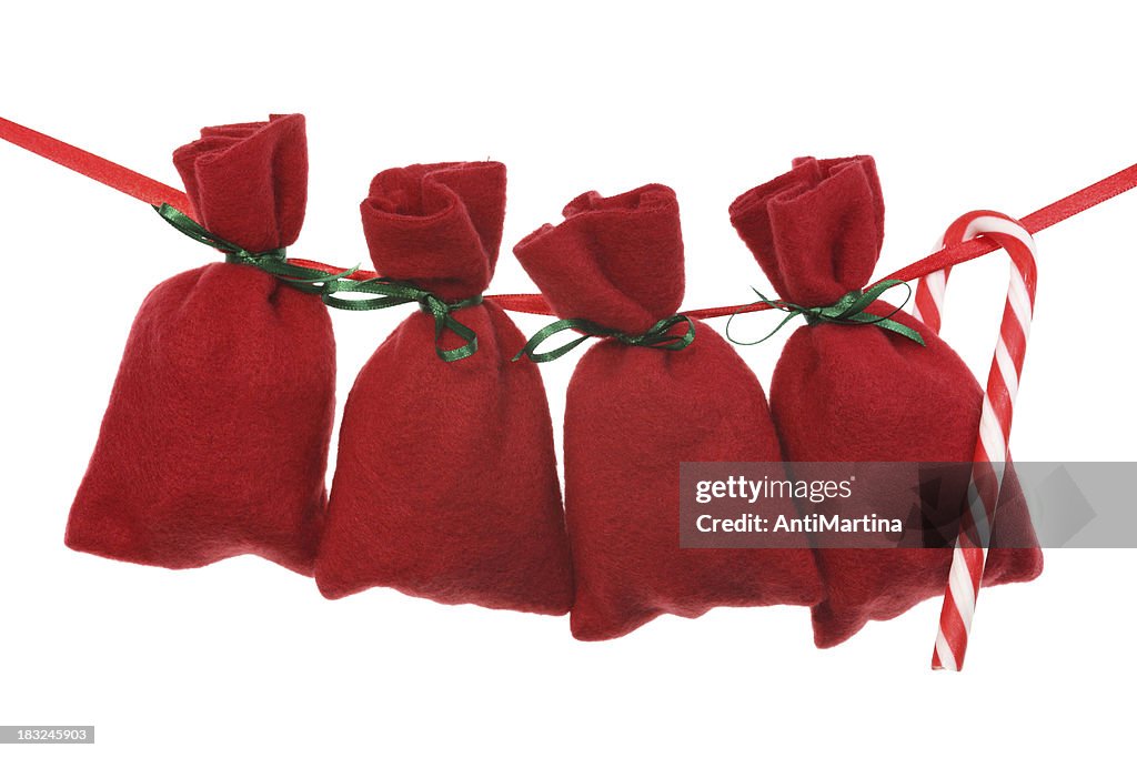 Red Christmas bags for advent calendar on a string