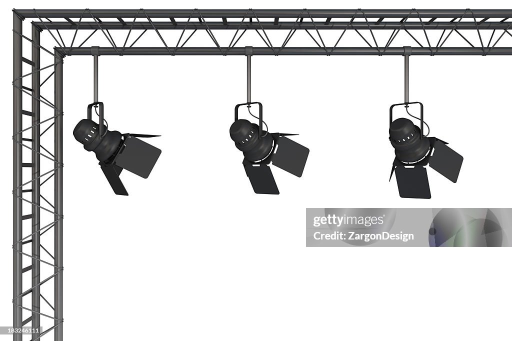 A rigging with 3 stage lights hanging from it