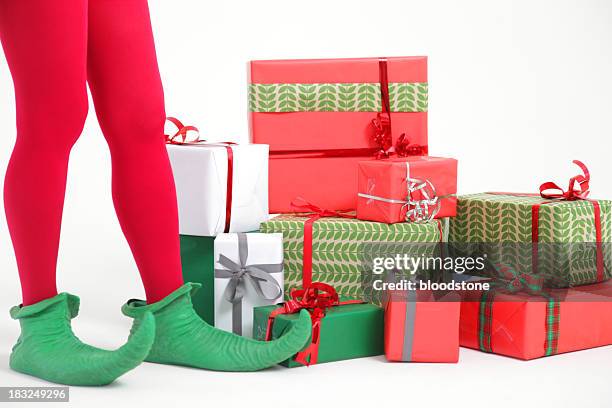 elf mit geschenken - feet christmas stock-fotos und bilder