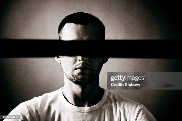 man with covered eyes - censorship stockfoto's en -beelden