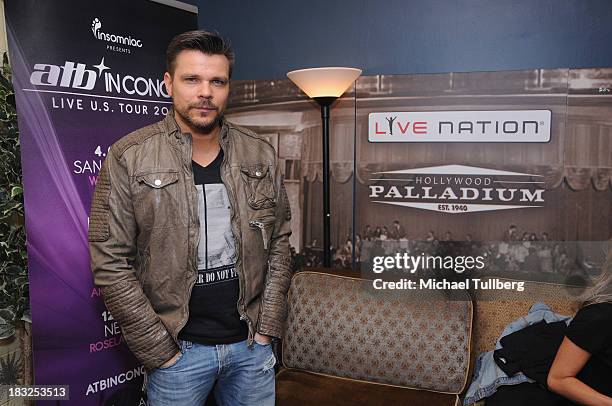 Electronic music artist ATB poses backstage at Hollywood Palladium on October 5, 2013 in Hollywood, California.