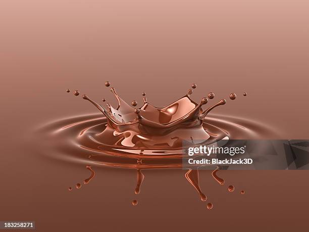 chocolate splash (crown - chocolate liquido fotografías e imágenes de stock