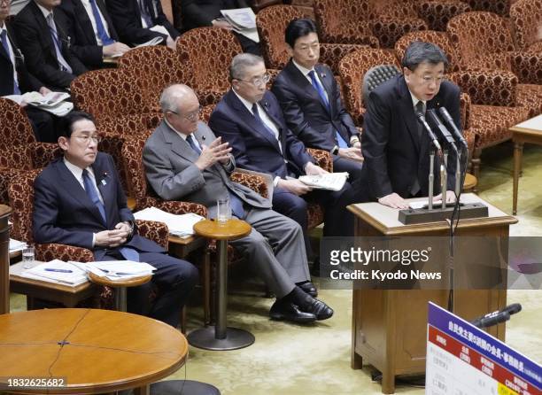 Japanese Chief Cabinet Secretary Hirokazu Matsuno speaks at an upper house committee session in Tokyo on Dec. 8 having been accused of failing to...