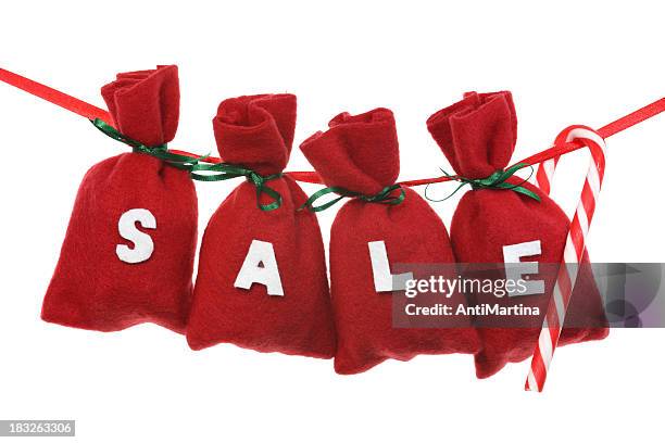 red christmas bags (sale) on a string - adventkalender stock pictures, royalty-free photos & images