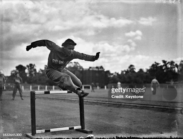 American hurdler Berenice Robinson running a hurdle during trainings before the Olympic Games, at the Uxbridge Olympic Centre, London, UK, 22nd July...