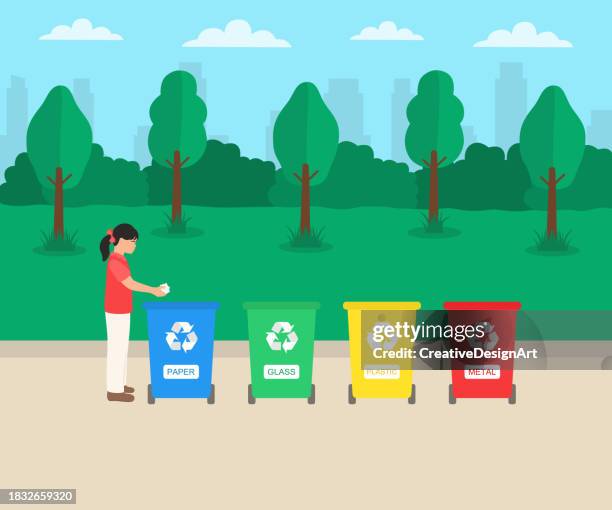 ilustraciones, imágenes clip art, dibujos animados e iconos de stock de niña tirando residuos de papel arrugados a la papelera de reciclaje. contenedores de reciclaje de papel, vidrio, plástico y metal para clasificar y reciclar residuos en el parque - huella de carbono