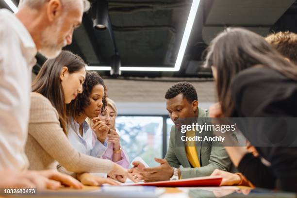 motivated people working on a project in the modern office - new experience stock pictures, royalty-free photos & images