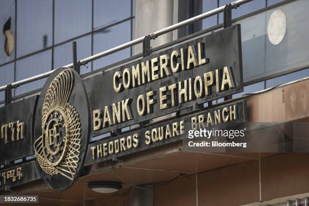 Signage above the entrance to a branch of the Commercial Bank of Ethiopia in Addis Ababa, Ethiopia, on Thursday, Dec. 7, 2023. The Horn of Africa...