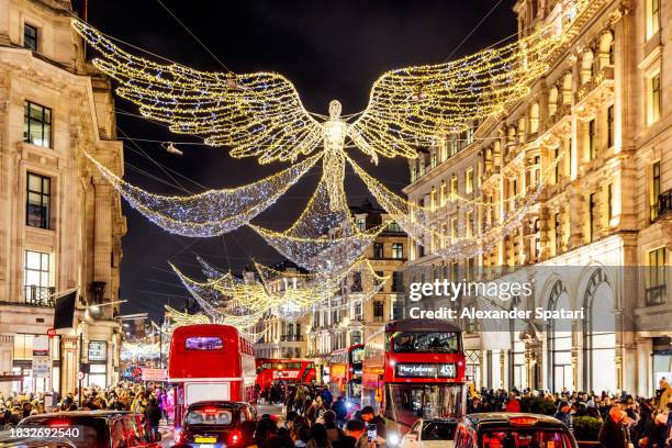 regent street decorated with christmas lights, london, uk - london at christmas stock pictures, royalty-free photos & images