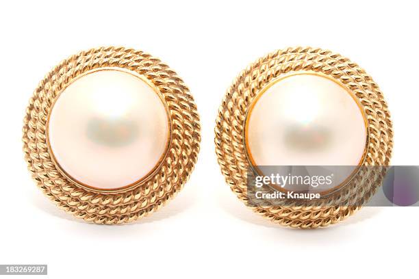 pair of round pearl earrings on white background - pearl earring stockfoto's en -beelden