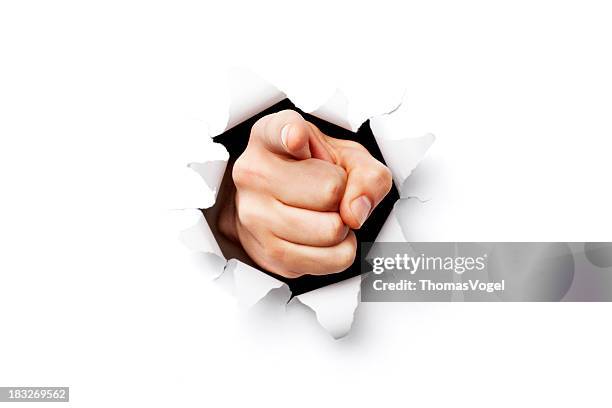 i want you finger coming through torn paper - pioint stock pictures, royalty-free photos & images