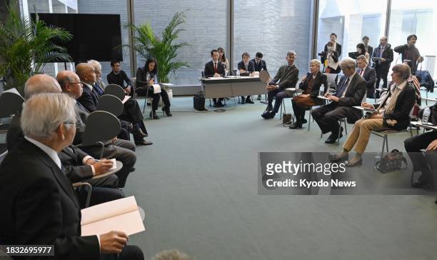 Attendees of the third meeting of the International Group of Eminent Persons for a World without Nuclear Weapons hold talks with atomic bomb...