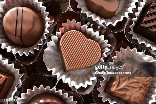 chocolates and love - milk chocolate truffles stock pictures, royalty-free photos & images