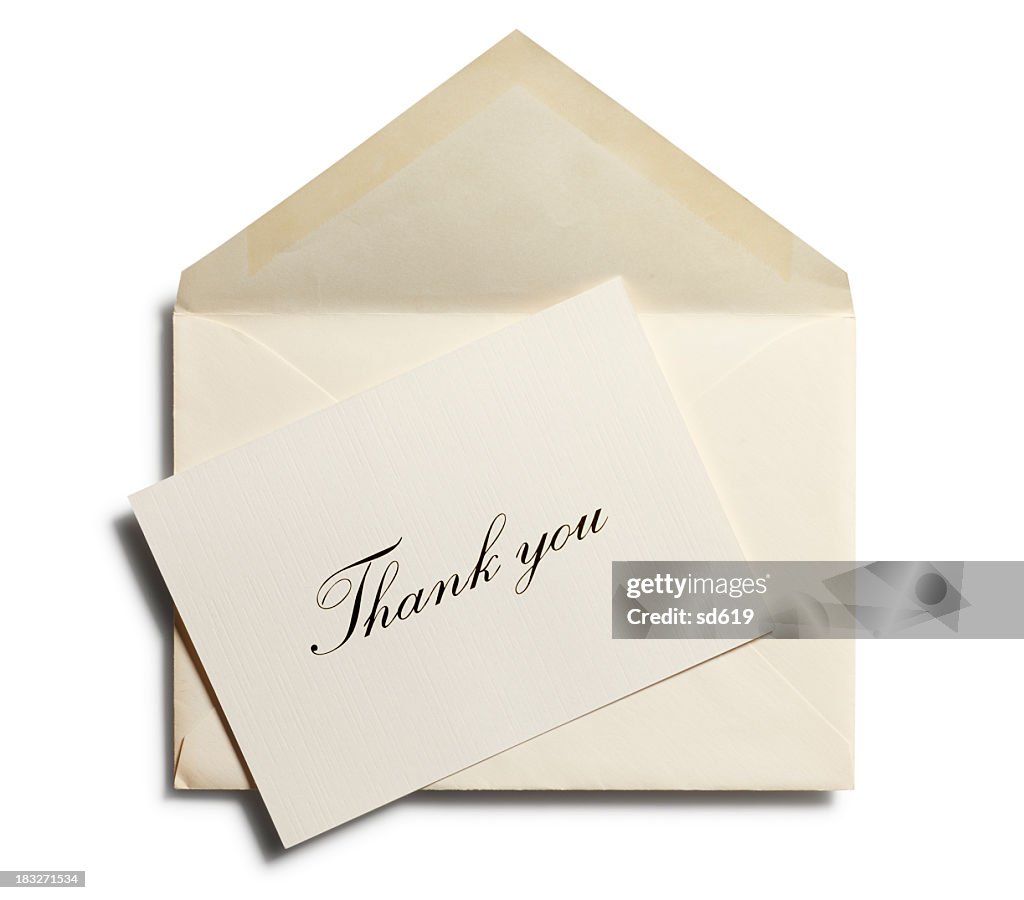 Thank you note against an open envelope isolated