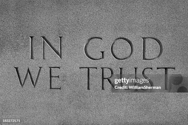 in god we trust, chiseled stone - in god we trust stock pictures, royalty-free photos & images