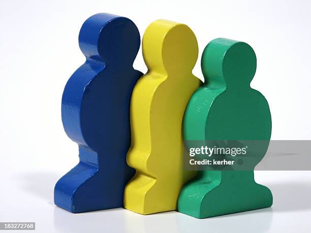 row of toy people - short guy tall woman stock pictures, royalty-free photos & images