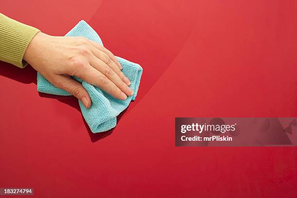 cleaning red glossy surface - duster stock pictures, royalty-free photos & images