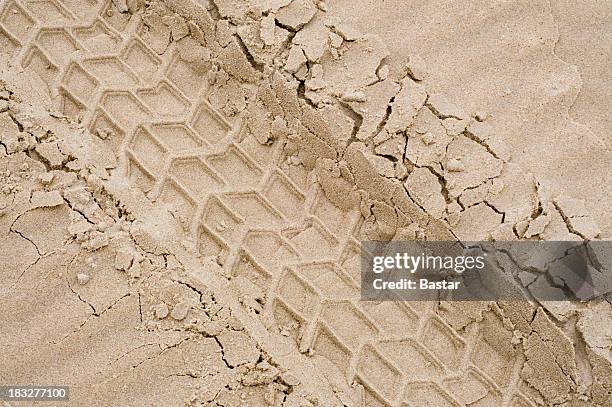 a picture of tire tracks in the sand - tyre print stock pictures, royalty-free photos & images