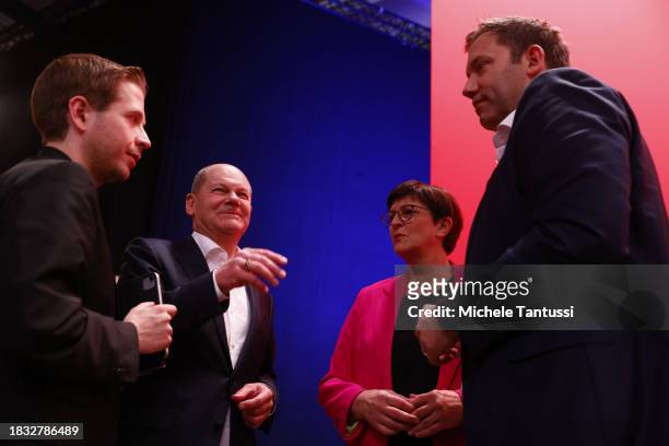 Saskia Esken and Lars Klingbeil, co-chairs of the German Social Democrats chat with German Chancellor, Olaf Scholz and Kevin Kuehnert at the SPD...