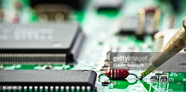 electronic component welding on a pcb - resistor stock pictures, royalty-free photos & images